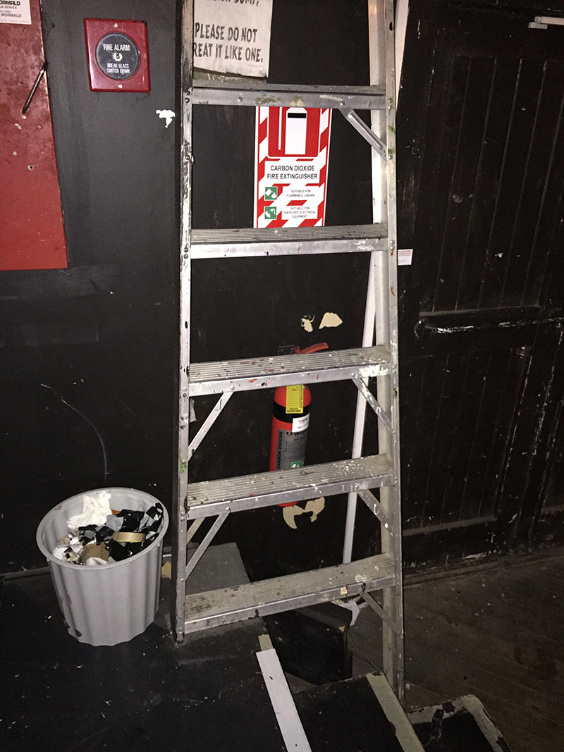 The ladder that can be seen in the foreground is fixed in place how one was ever to access the fire extinguisher in a panic is beyond belief. Needless to say the extinguisher is no longer there.